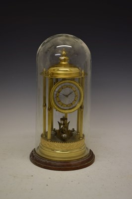 Lot 495 - Large anniversary or torsion clock beneath glass dome
