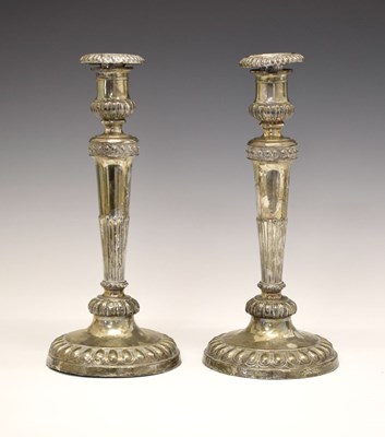Lot 151 - Pair of George III silver candlesticks on tapering fluted columns