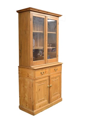 Lot 740 - Pine bookcase on cabinet