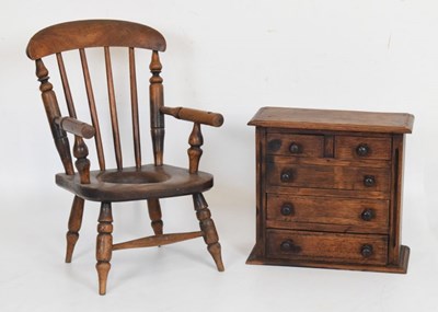 Lot 679 - Child's chair and a small chest of drawers