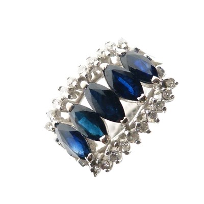 Lot 15 - White metal (14K) sapphire and diamond ring