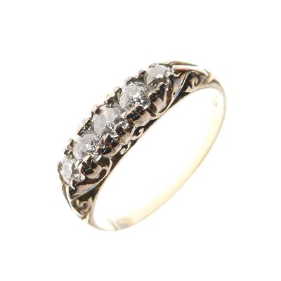 Lot 26 - Unmarked yellow metal ring of five graduated old-cut diamonds
