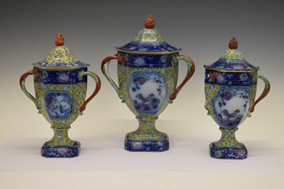 Lot 300 - Garniture of three pedestal urns and covers