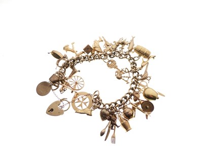 Lot 127 - 9ct curb-link charm bracelet, 74g gross approx