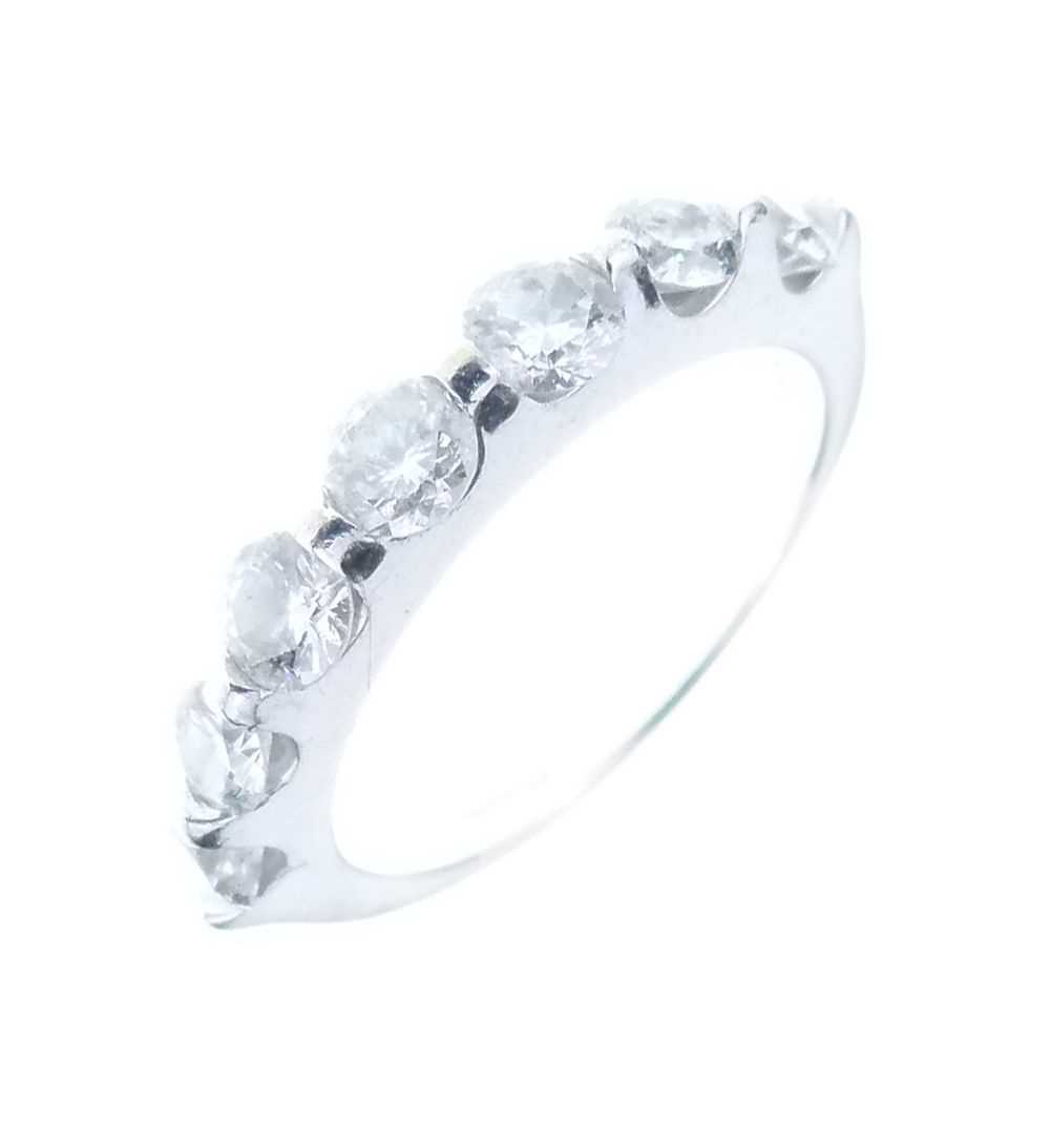 Lot 12 - Seven stone diamond half hoop ring