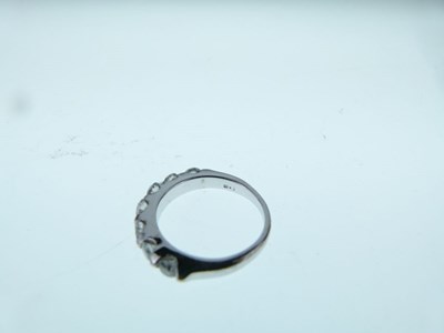 Lot 12 - Seven stone diamond half hoop ring