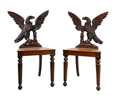 Lot 721 - Pair of Victorian carved oak armorial hall chairs