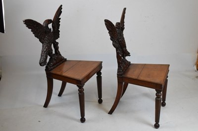 Lot 721 - Pair of Victorian carved oak armorial hall chairs
