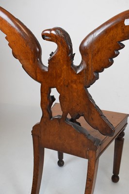 Lot 721 - Pair of Victorian carved oak armorial hall chairs