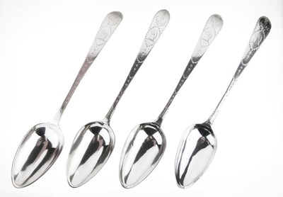 Lot 93 - Set of four George III Irish tablespoons with bright cut decoration