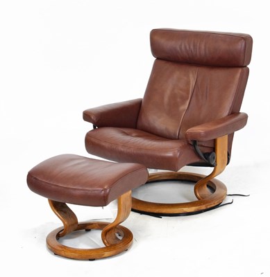 Lot 719 - Ekornes Stressless chair and stool in tan coloured covering