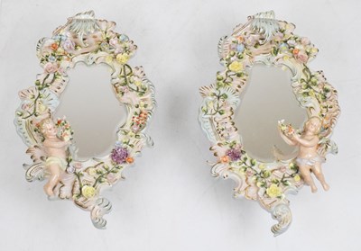 Lot 304 - Pair of 20th Century German Sitzendorf porcelain mirrors