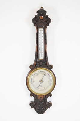 Lot 349 - Edwardian carved oak aneroid barometer