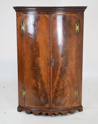 Lot 458 - Inlaid mahogany bowfront corner cupboard