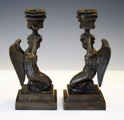 Lot 156 - Pair of patinated bronze candlesticks