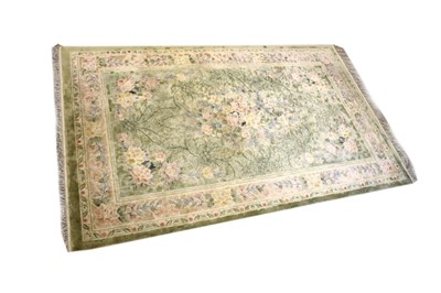 Lot 434 - 20th Century Chinese wool rug with floral decoration