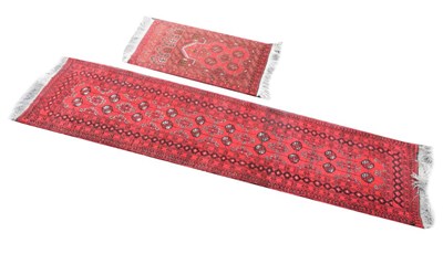 Lot 429 - Middle Eastern red ground runner and prayer rug