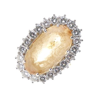 Lot 9 - Topaz and diamond cluster ring