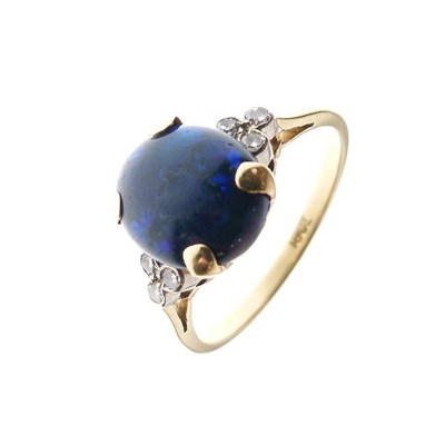 Lot 16 - Black opal single stone ring set three diamonds to each shoulder