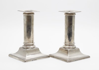 Lot 81 - Pair of George V silver candlesticks