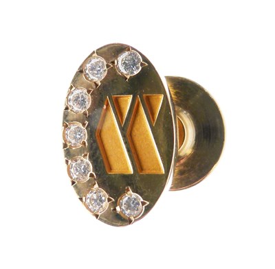 Lot 45 - Yellow metal (14K) lapel badge, set seven diamonds