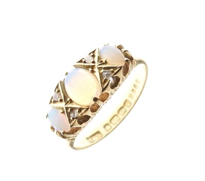 Lot 15 - Edwardian 18ct gold ring set three opals and rose cut diamonds