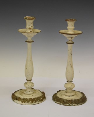 Lot 675 - Pair of cream and gilt wooden candlesticks