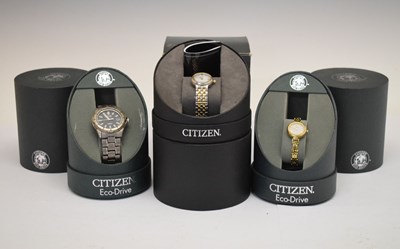 Lot 130 - Citizen Eco-Drive - Gentleman's Titanium stainless steel wristwatch and two lady’s watches