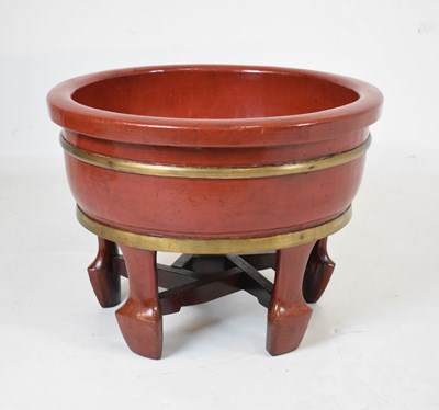 Lot 715 - Chinese red lacquer planter standing on four feet