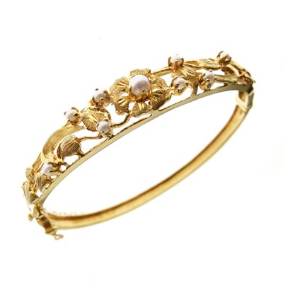 Lot 82 - 9ct gold and seed pearl snap bangle