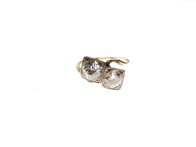 Lot 275 - Two-stone diamond crossover ring