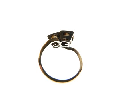 Lot 275 - Two-stone diamond crossover ring