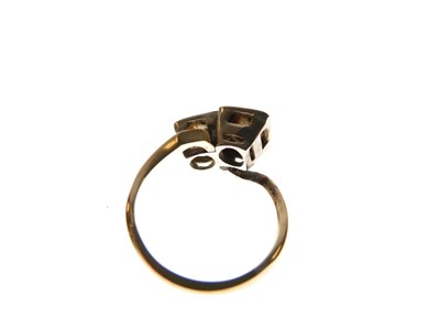 Lot 275 - Two-stone diamond crossover ring