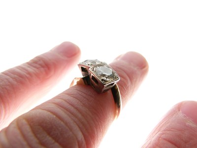 Lot 275 - Two-stone diamond crossover ring
