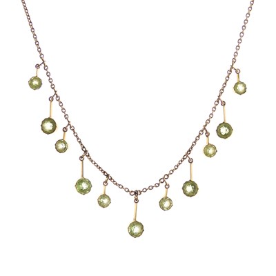 Lot 308 - Edwardian peridot fringe necklace