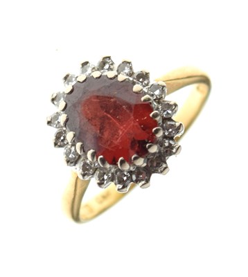 Lot 27 - 18ct gold cluster ring set diamonds and garnet-coloured stone