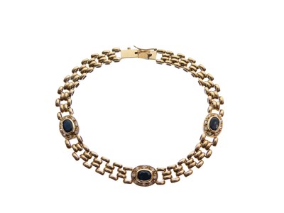 Lot 80 - Yellow metal and sapphire mounted bracelet, stamped '750', 9.4g