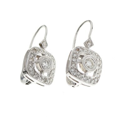 Lot 40 - Pair of pavé set diamond cluster earrings