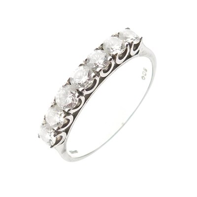 Lot 277 - Seven-stone diamond platinum half-hoop ring