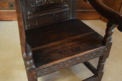 Lot 20 - Charles II oak panel-back open armchair