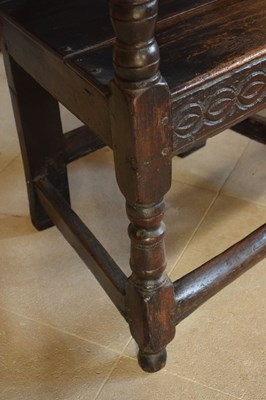 Lot 20 - Charles II oak panel-back open armchair