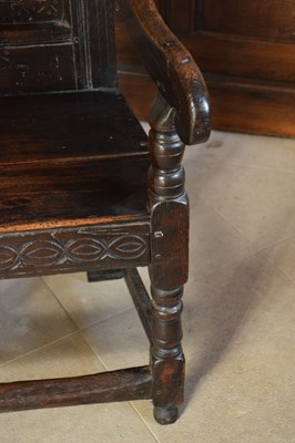 Lot 20 - Charles II oak panel-back open armchair