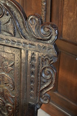 Lot 20 - Charles II oak panel-back open armchair