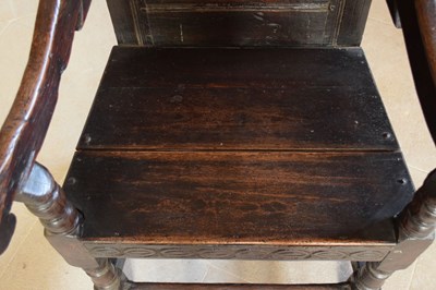 Lot 20 - Charles II oak panel-back open armchair