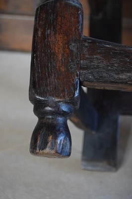 Lot 20 - Charles II oak panel-back open armchair