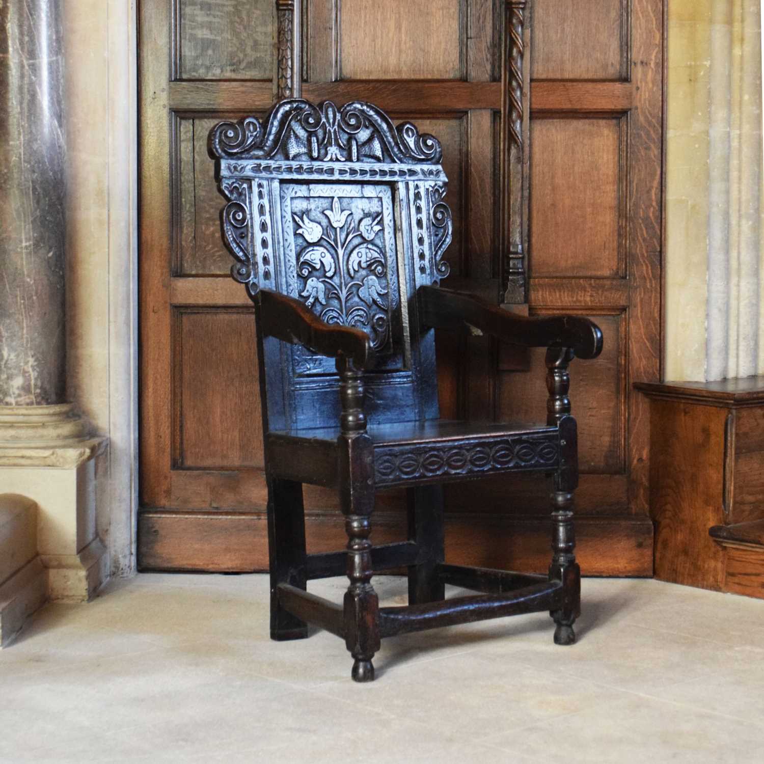 Lot 20 - Charles II oak panel-back open armchair