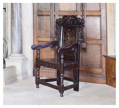 Lot 20 - Charles II oak panel-back open armchair
