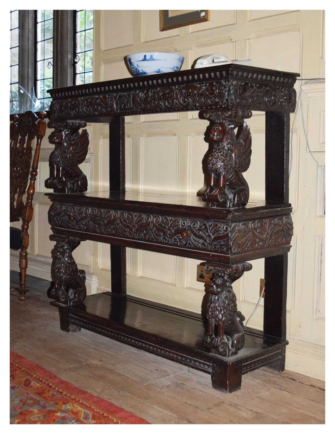 Lot 25 - Charles I carved oak three-tier open ‘court cupboard’ or buffet
