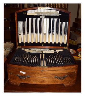 Lot 604 - Mahogany-cased bowfront canteen of silver-plated cutlery or flatware