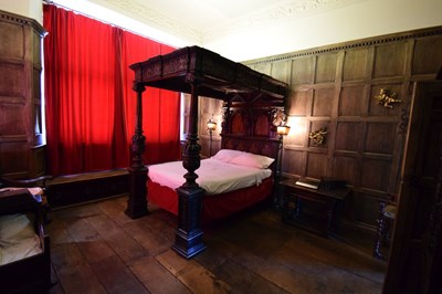 Lot 63 - Impressive carved oak and marquetry-inlaid tester bed